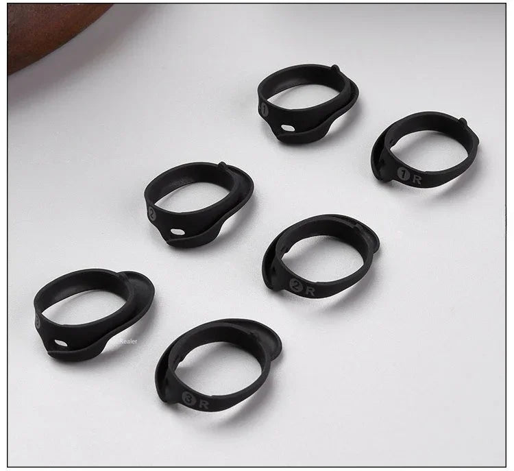 A collection of black silicone ear tips for true wireless earbuds, shown from various angles.