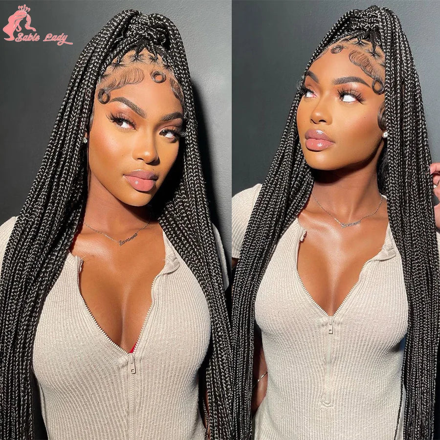 A model wearing a 36 inch full lace box braids wig with intricate face painting and a light beige top.