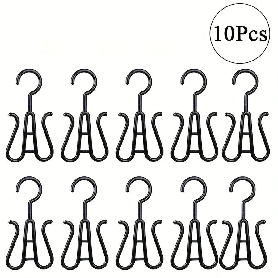 A set of ten black multi-use wig and accessory hangers.