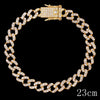 A gold crystal Cuban link anklet with a rectangular clasp and a 23cm chain is displayed against a black background.