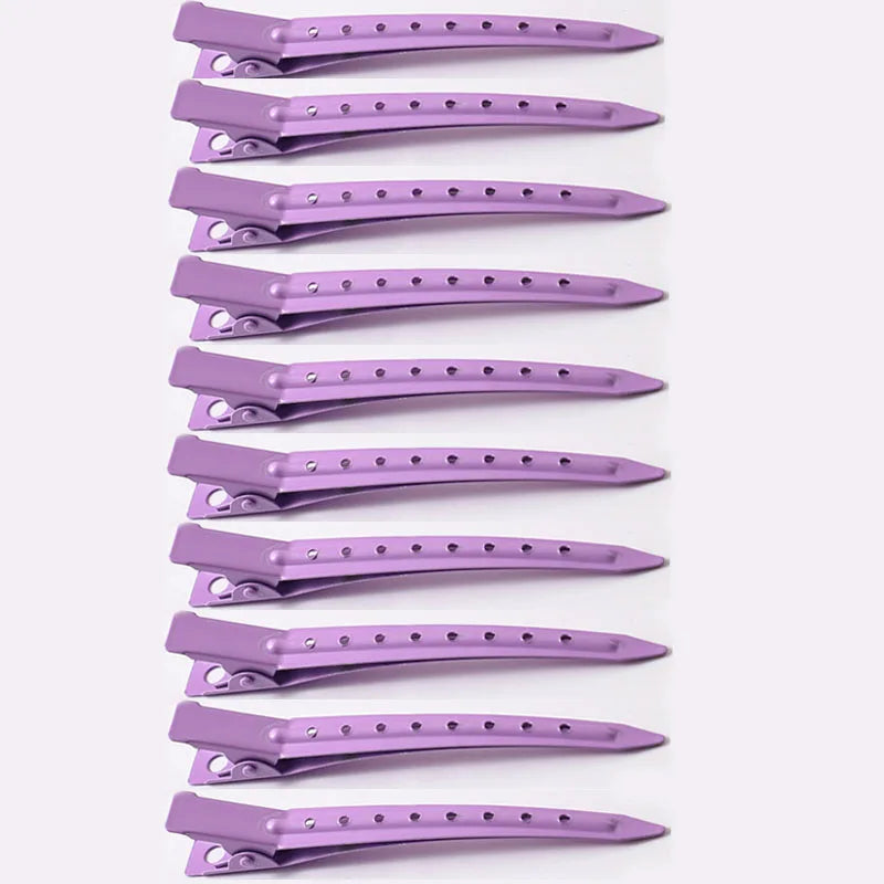 A vertical arrangement of purple professional fixed hair pins for styling.
