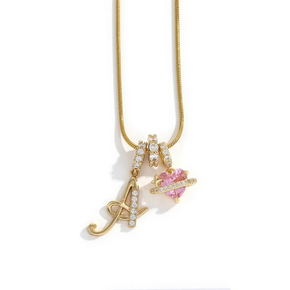 Gold letter A and flower pendant necklace with pink gemstone accents