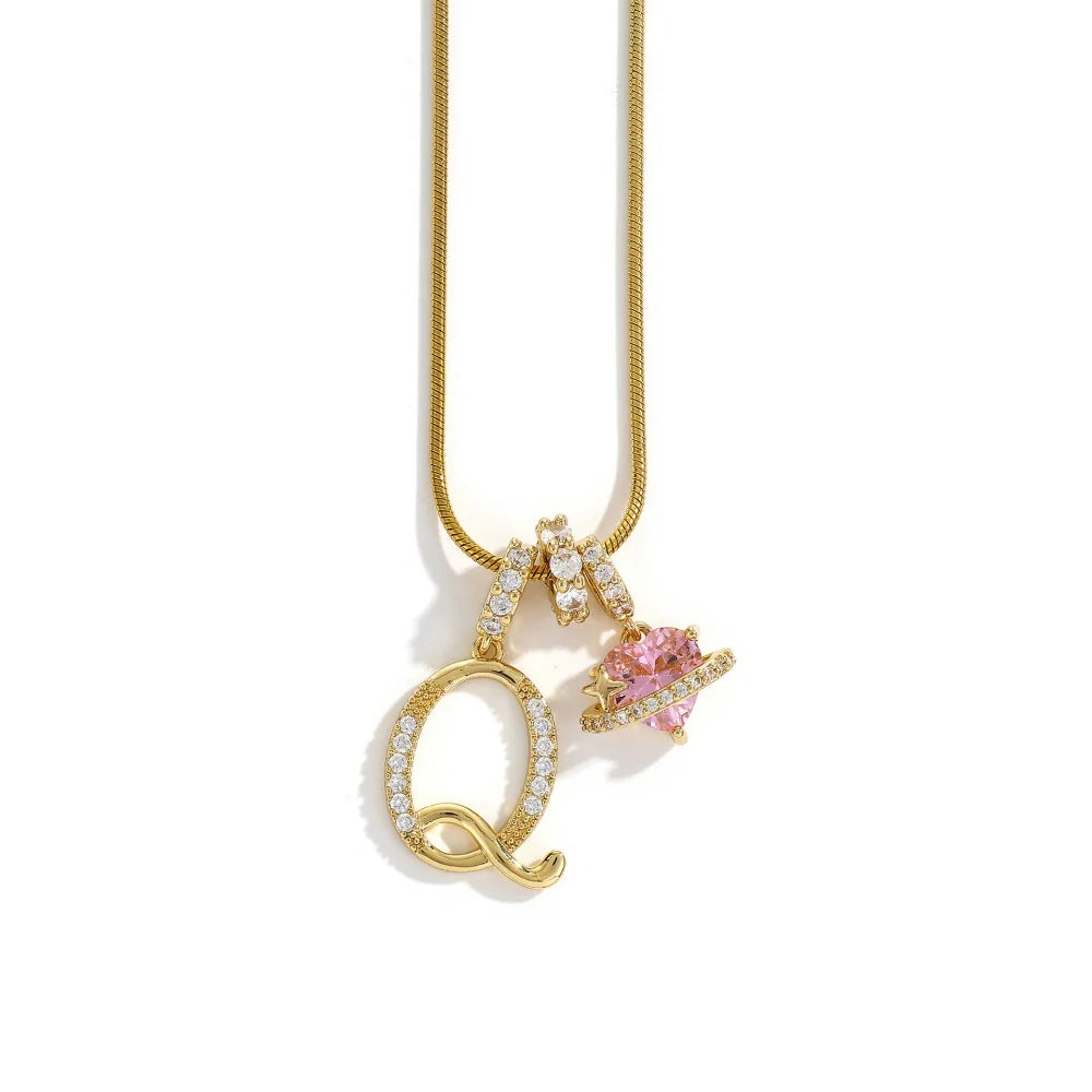 A gold chain necklace featuring an alphabet letter pendant shaped like a flower.