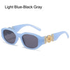 Light blue-black gray sunglasses with rose metal detail frame
