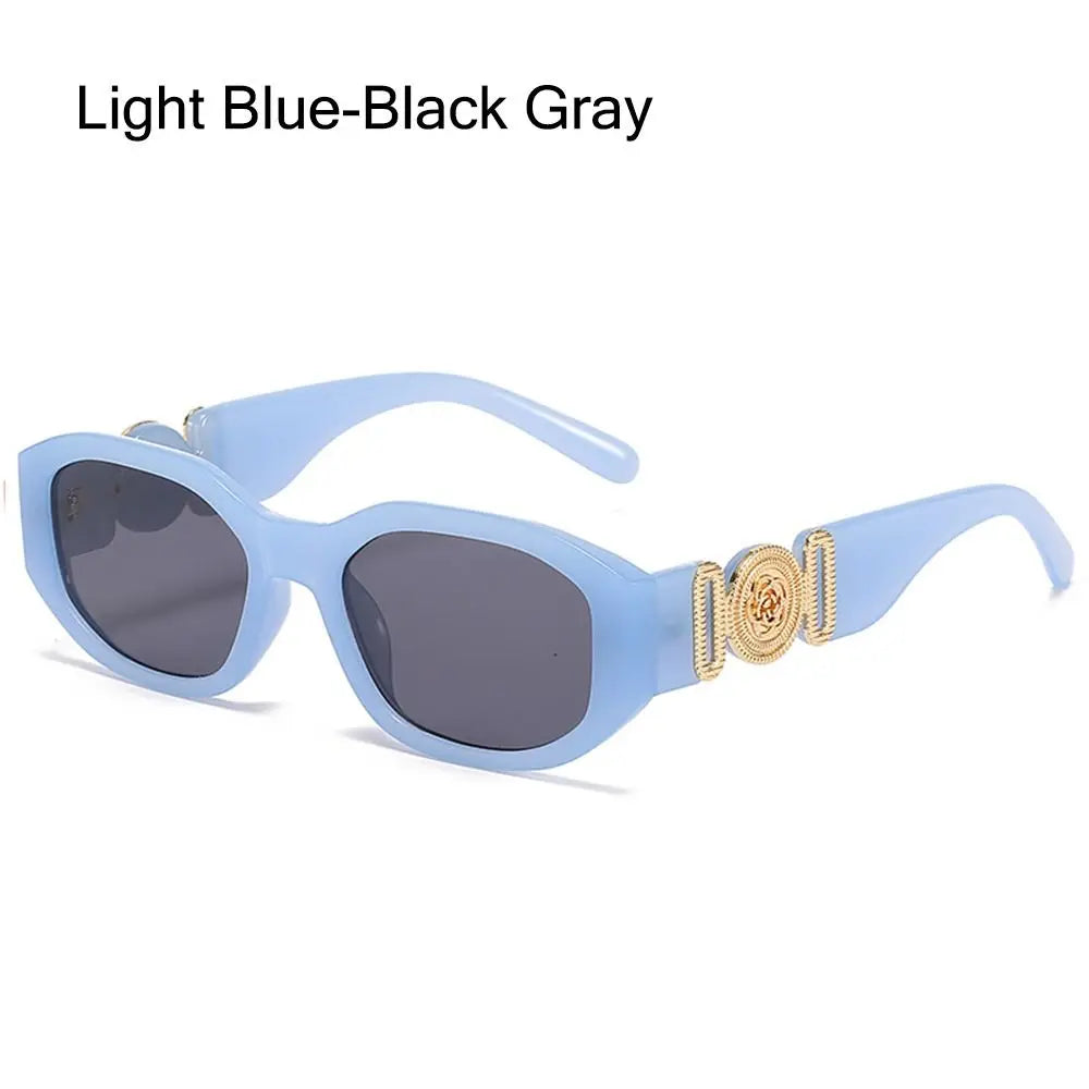 Light blue-black gray sunglasses with rose metal detail frame