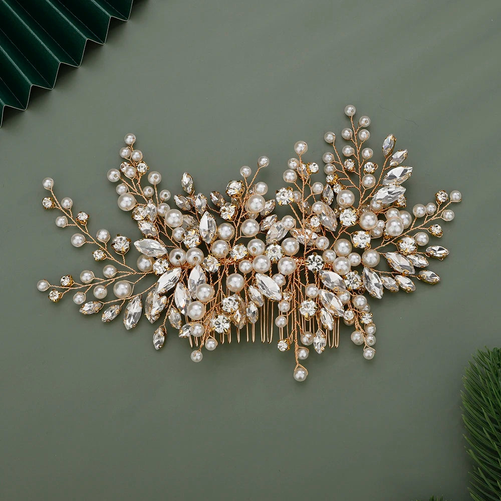 A delicate bridal headpiece made of pearl and rhinestone embellishments arranged in a floral spray.
