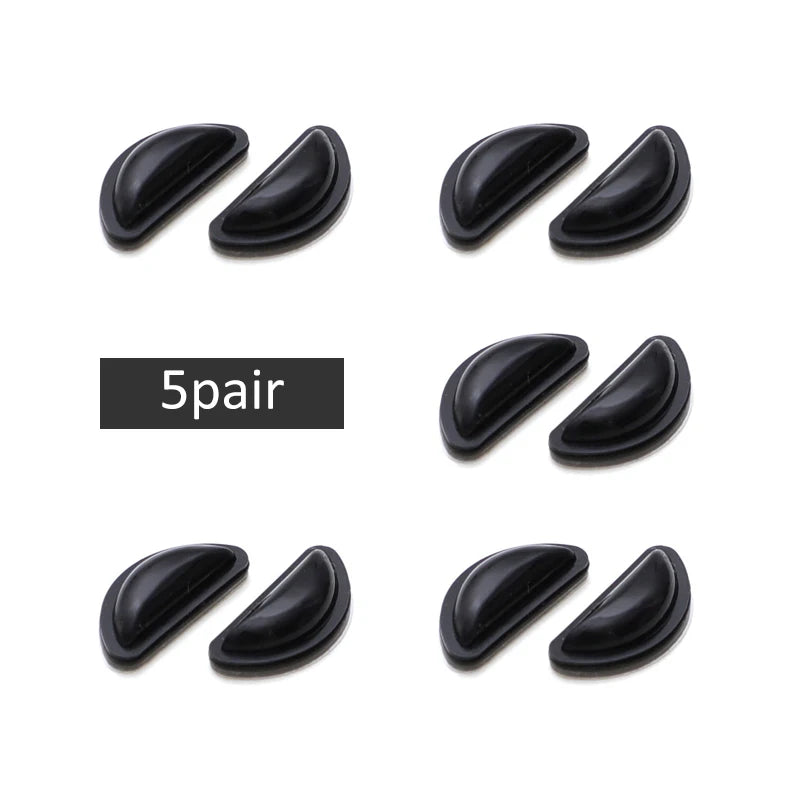 Five pairs of black silicone nose pads for eyeglasses shown in various angles
