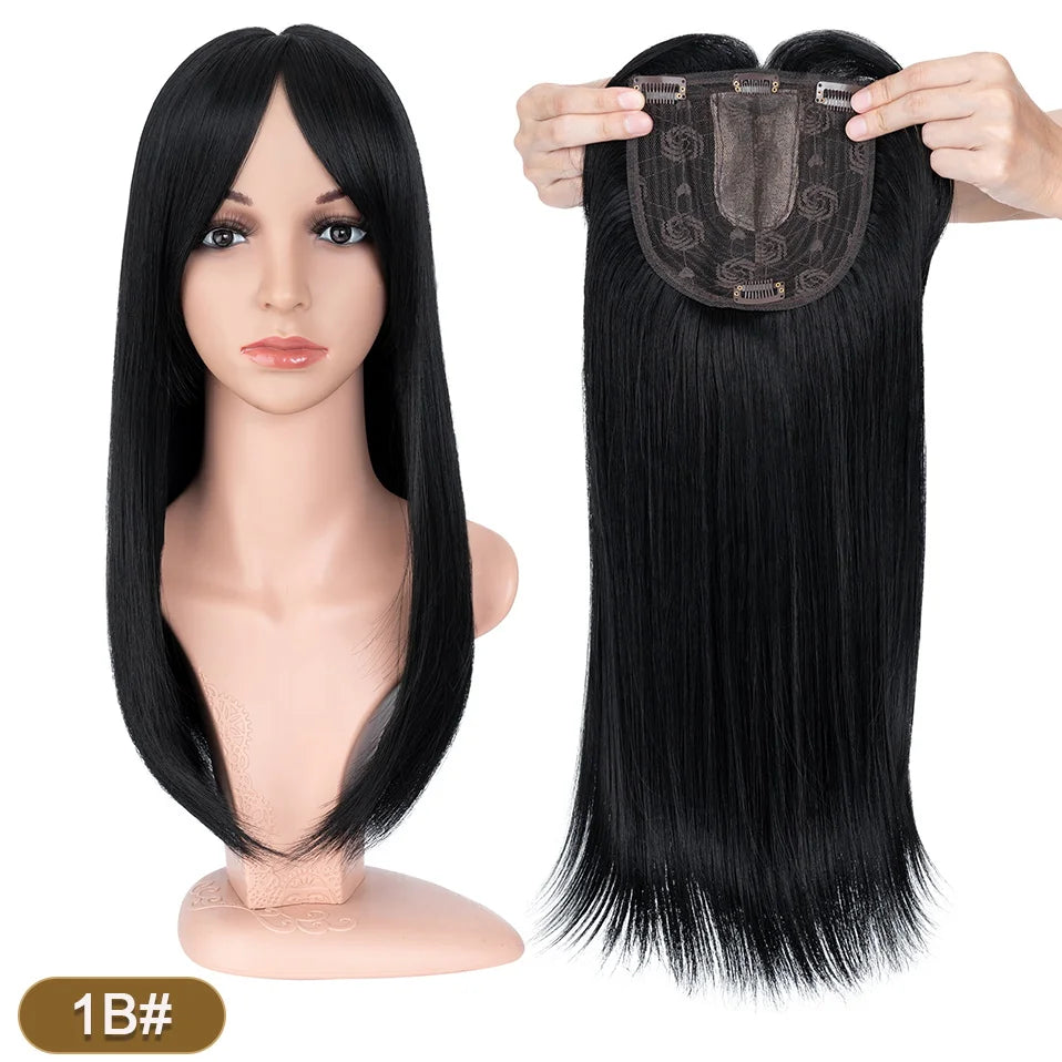 A long, straight black hair topper with bangs is shown on a mannequin head and as a separate piece.
