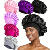 Collection de bandeaux pour cheveux en soie satinée, roses, violets et noirs, présentés sur un visage.