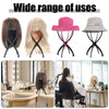 Soporte plegable portátil para exhibir pelucas y piezas de cabello, incluyendo un sombrero rosa y uno gris.