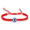 Red braided charm bracelet with a blue and white evil eye bead for protection