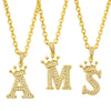 Gold initial name crown pendant necklace featuring a letter A and an S design