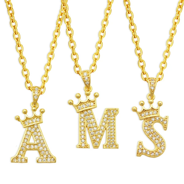 Gold initial name crown pendant necklace featuring a letter A and an S design