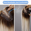 A hand is applying a light brown blonde ombre lace base hair topper to dark hair, demonstrating its breathable and comfortabl