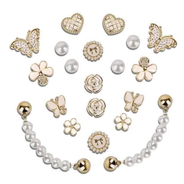 A set of 20 sparkling rhinestone shoe charms, including heart and flower shapes, pearls, and gold accents.