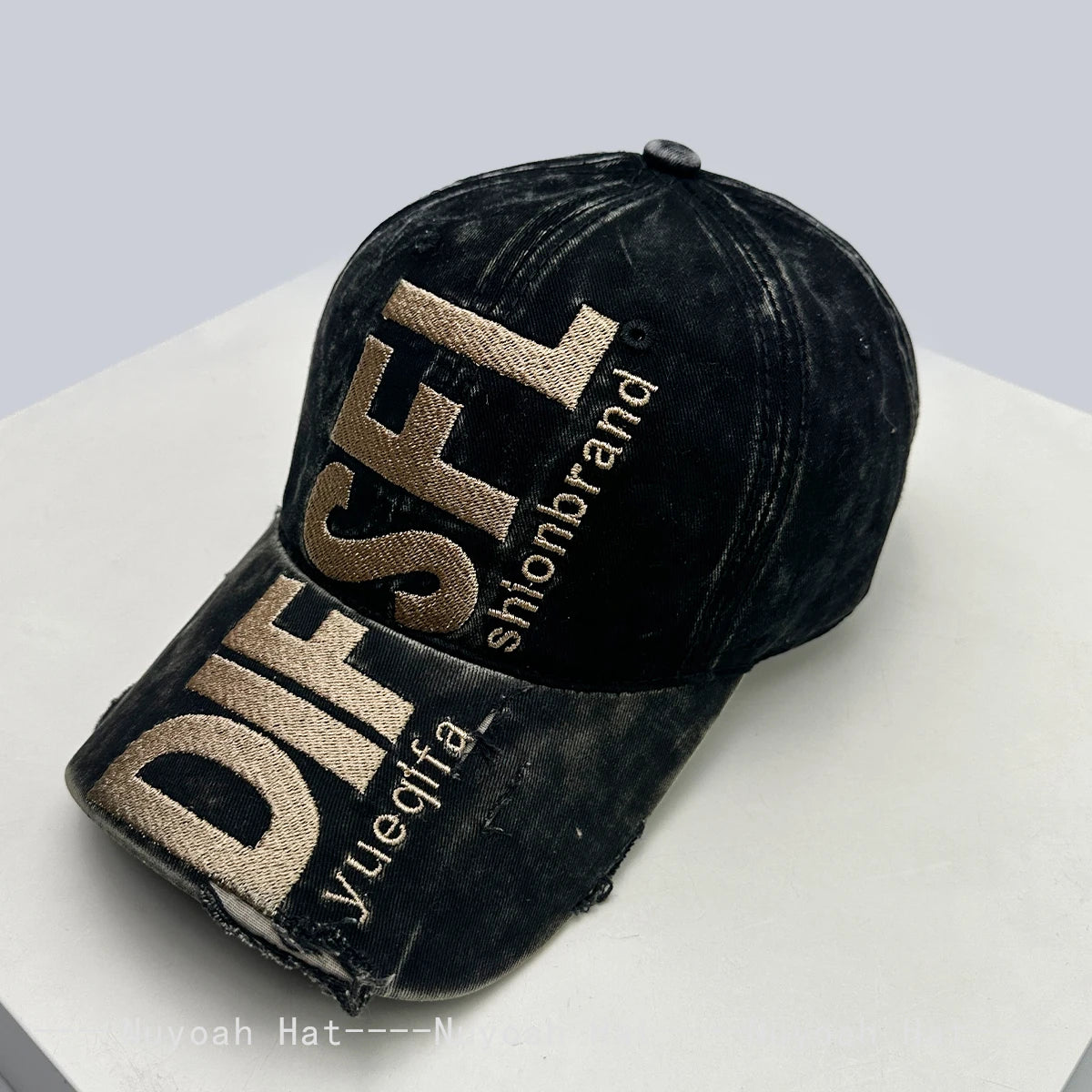 A black baseball cap embroidered with gold letters DIFSL and Yueqfa on a white surface.