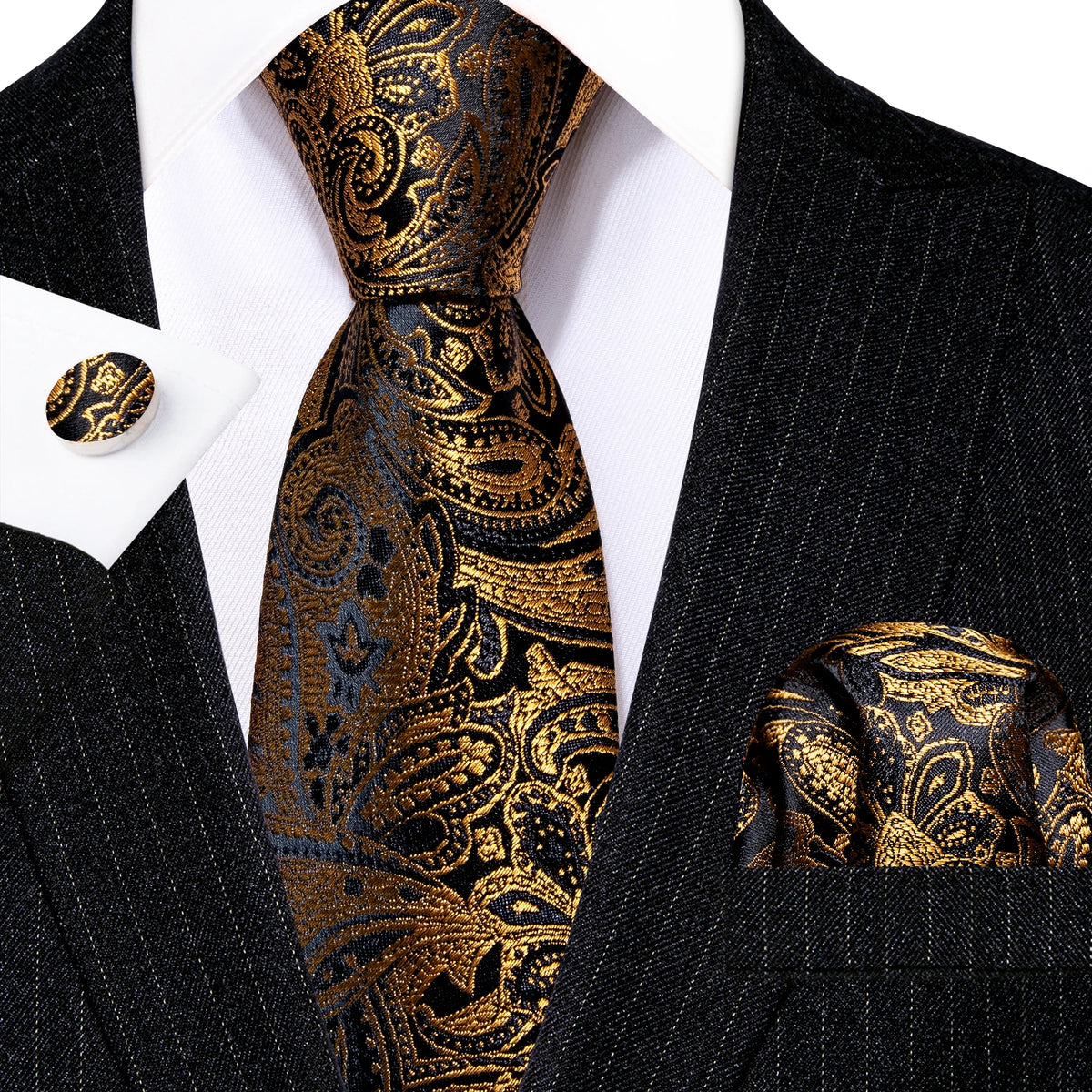 A close-up of a men's silk jacquard tie set featuring a black background with intricate gold paisley patterns.