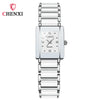 A silver luxury quartz couple watch with a stainless steel band and a square face.