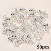 A collection of 50 clear diamond-cut metal hair rings and clips set.