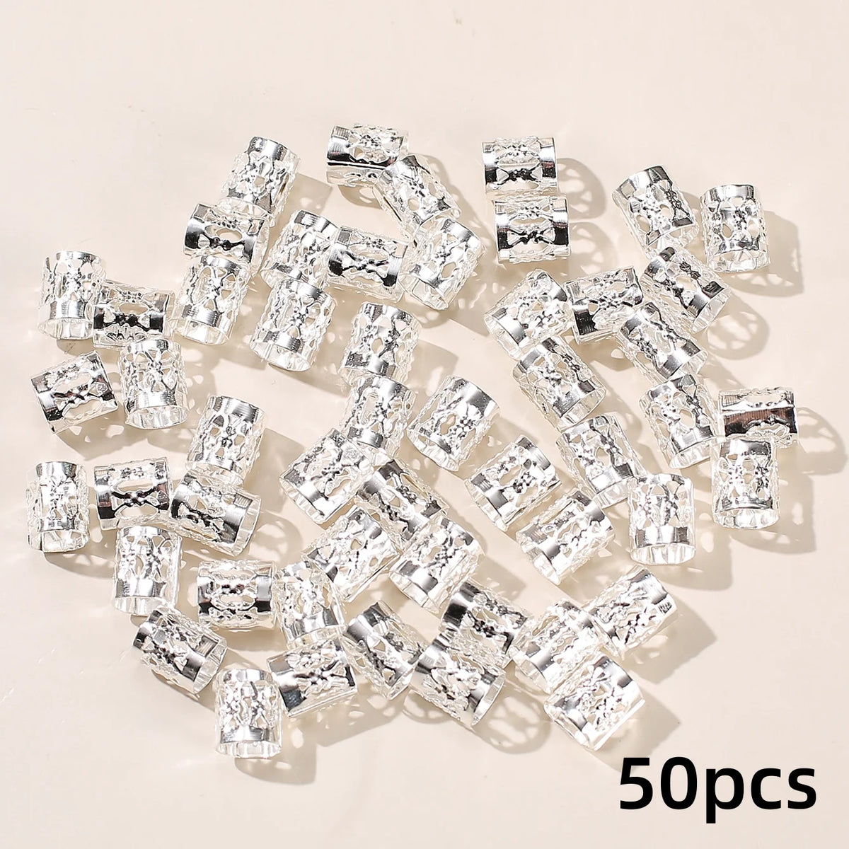 A collection of 50 clear diamond-cut metal hair rings and clips set.