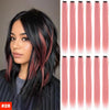 A woman models long, straight hair extensions in a pink and black ombré style.