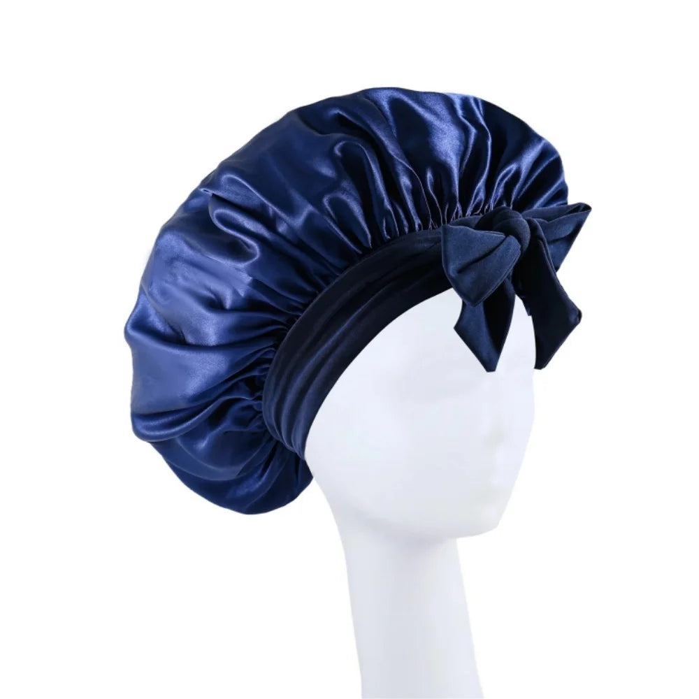 A navy blue satin wide-brimmed hair wrap headscarf displayed on a white mannequin.