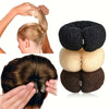 Demonstration of an elegant gauze hair bun tool used to style and secure curly hair.
