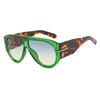 Retro oval sunglasses with green frames and tortoiseshell lenses