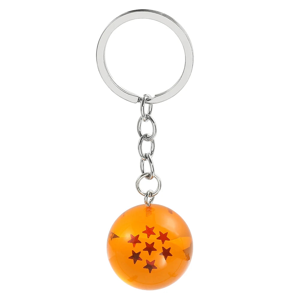 Silver hoop keychain with an orange spherical charm decorated with red stars
