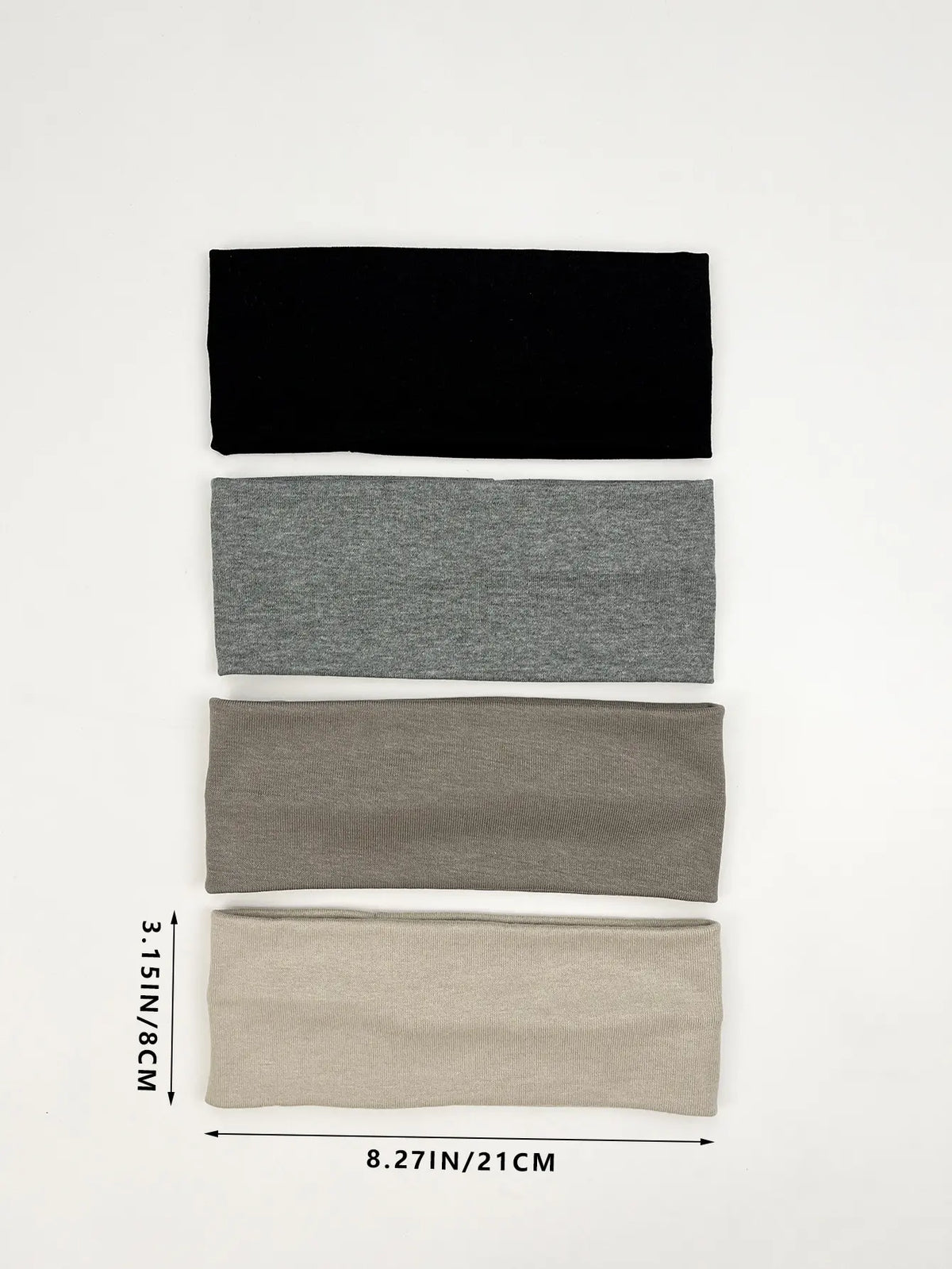 A set of four knitted hair bands in black, gray, taupe, and beige stacked vertically.