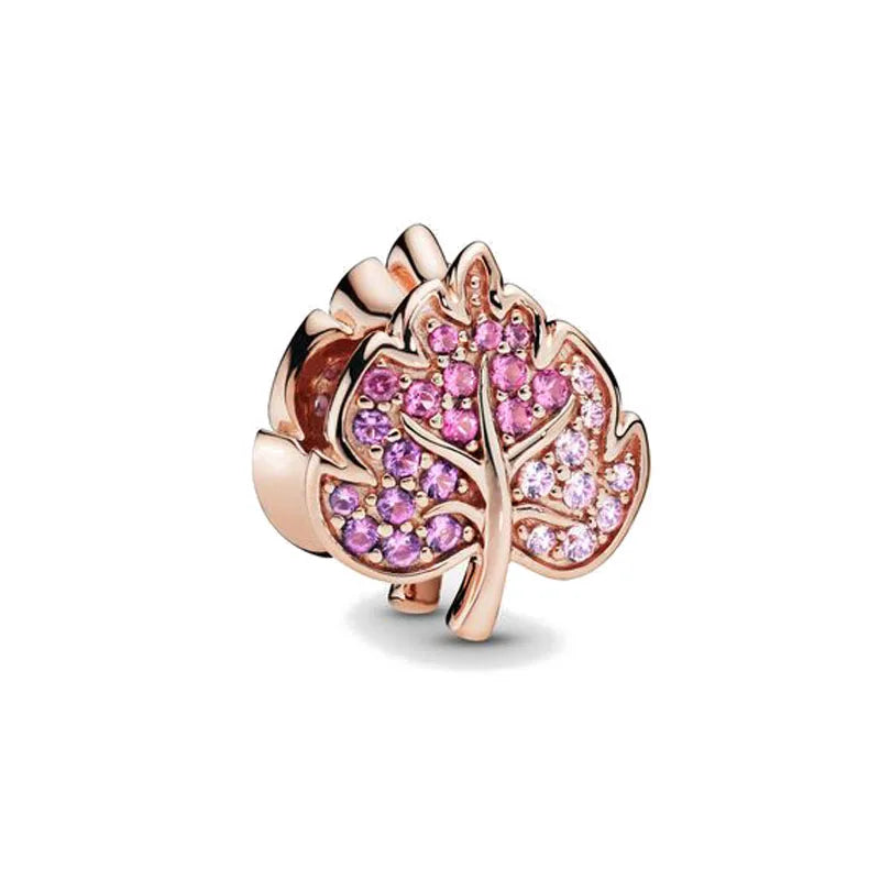 Rose gold cherry blossom charm pendant featuring pink gemstones.