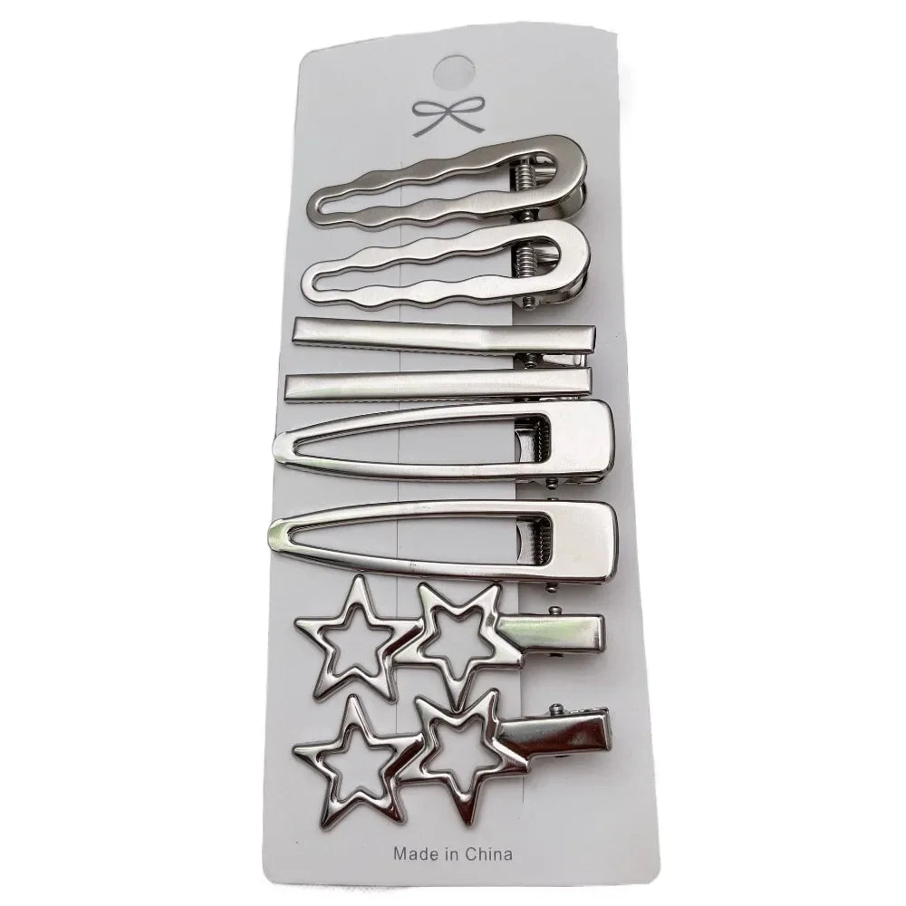 A set of vintage silver Y2K metal hair clips, including various clip styles and star-shaped clips.