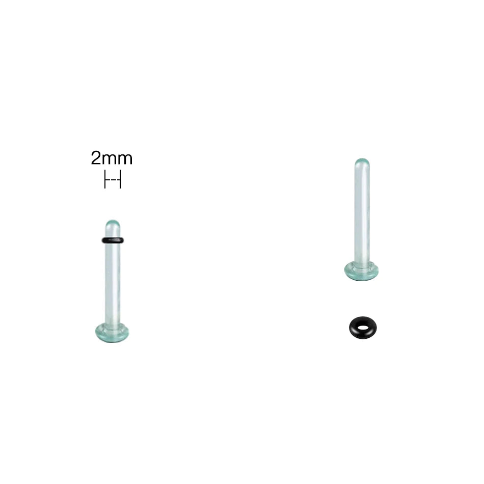 A glass ear stretching kit showing a 2mm tube and a small black ring.