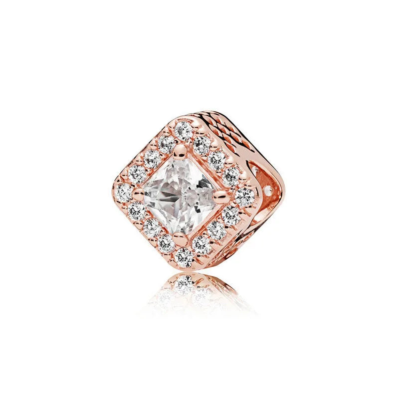 Rose gold cherry blossom charm pendant featuring a clear diamond-cut stone surrounded by small diamonds