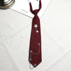 A dark maroon tie featuring a silver chain star accessory for college and trendy accessories.