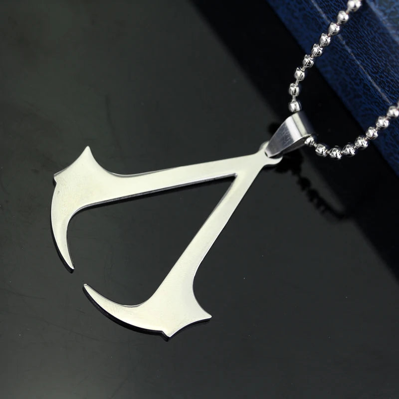 Stainless steel pendant necklace shaped like a dagger or blade with a silver chain