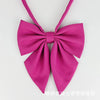 A pink butterfly ribbon tie set featuring a bow design.