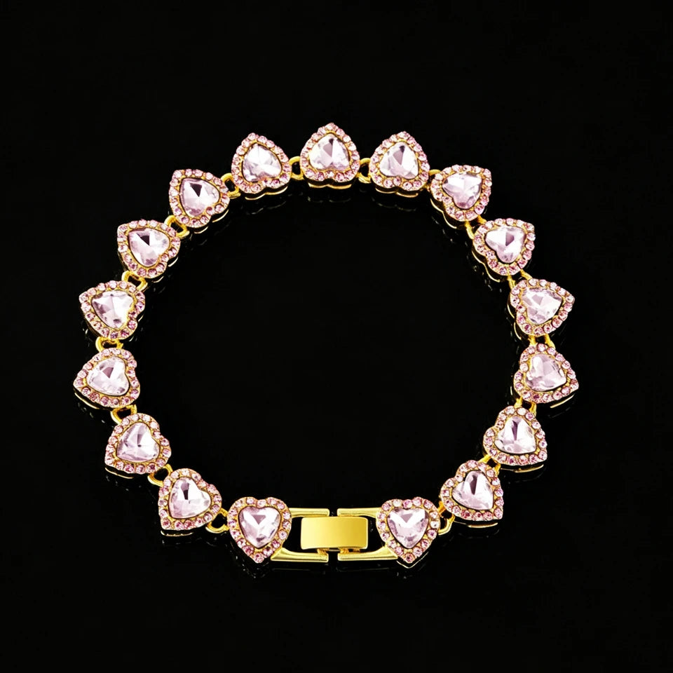 A set of sparkling heart rhinestone necklaces and bracelets in pink and gold tones.