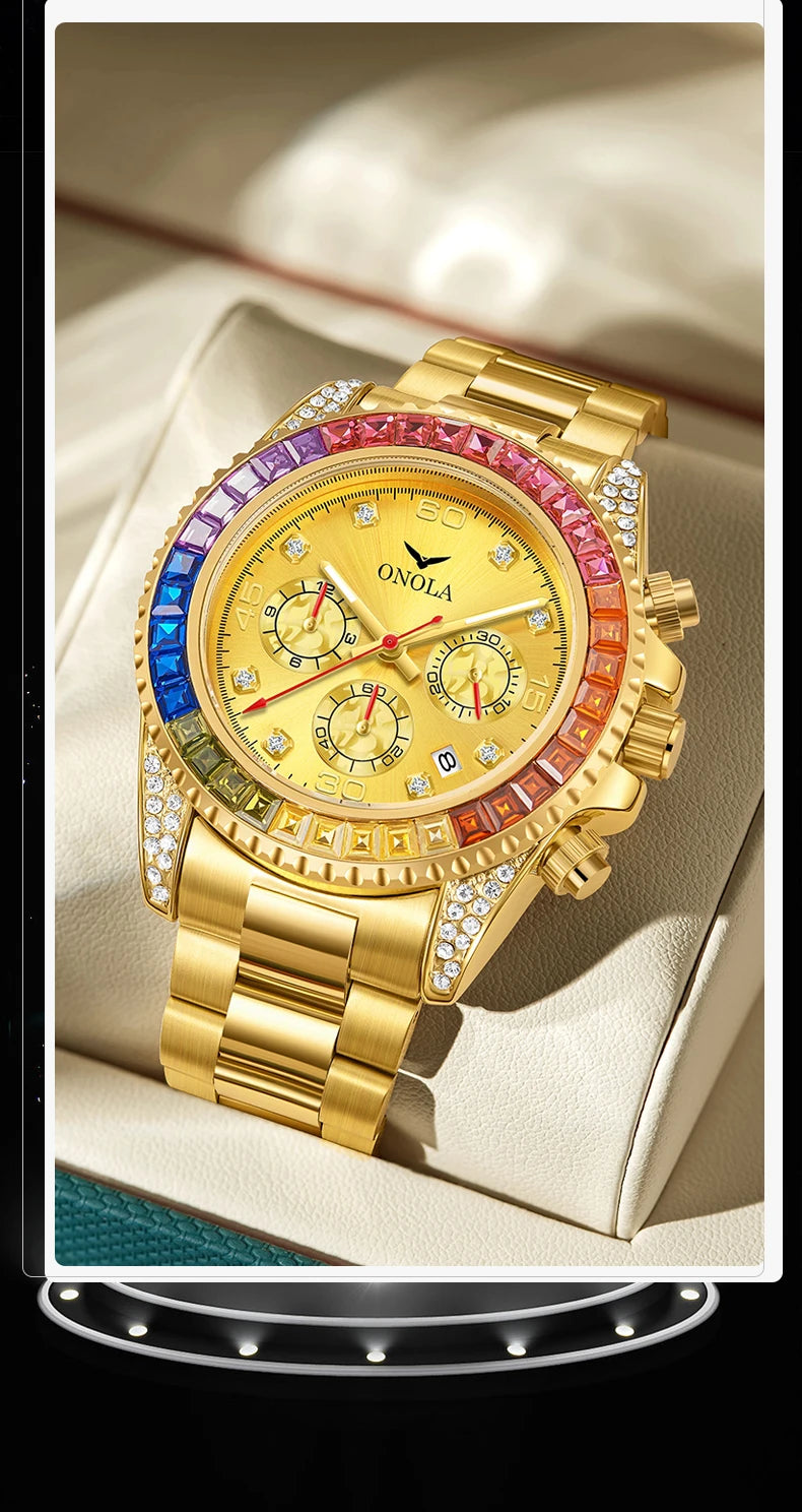 A gold quartz watch with a pink and blue bezel and diamond accents resting on a light-colored surface.