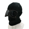 Black knit windproof hat with dark tinted goggles displayed on a white mannequin.
