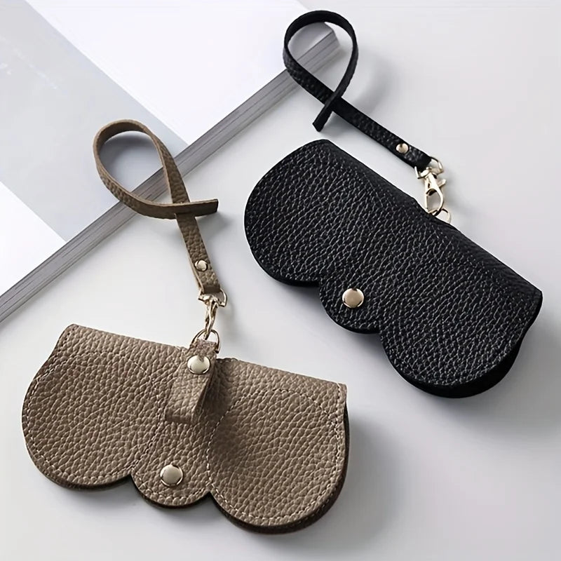 A set of dark brown PU leather eyewear pouch and glasses case with a black strap.