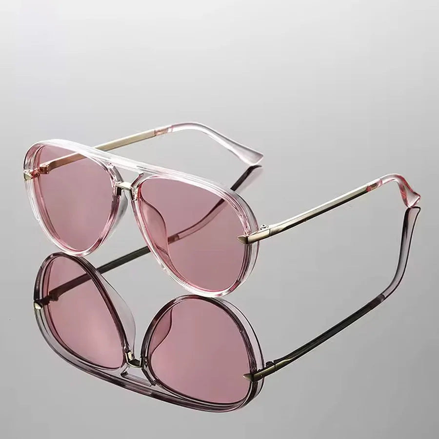 Pink tinted retro large frame sunglasses with thin gold metal arms