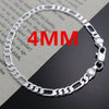 A silver charm necklace and bracelet set displayed on a piece of paper with red text indicating 4mm thickness.
