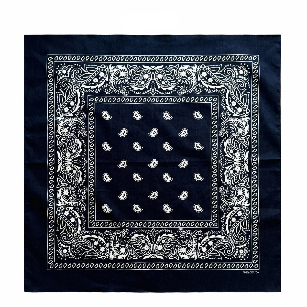 A dark blue bandana scarf with white paisley and floral embroidery on the border and a central square pattern.
