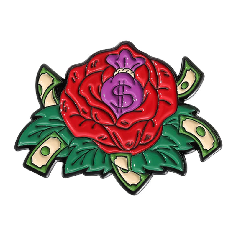 A colorful enamel brooch featuring a large red rose with a purple dollar sign in the center surrounded by green leaves.