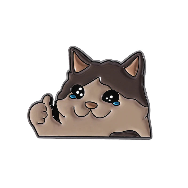 A cute, stylized cat face enamel pin with large eyes and a smiling expression.