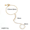 Gold plated stainless steel bracelet with a main chain measuring 170mm plus a 30mm extender and a dangling charm.