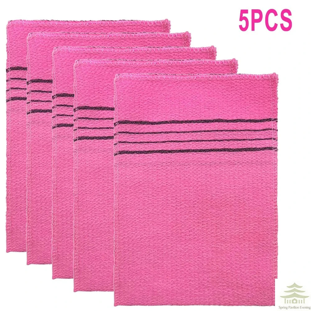 A set of five pink exfoliating bath washcloths with black stripes.