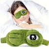 A green plush frog mask is shown being worn by a child, highlighting its eye relief features.