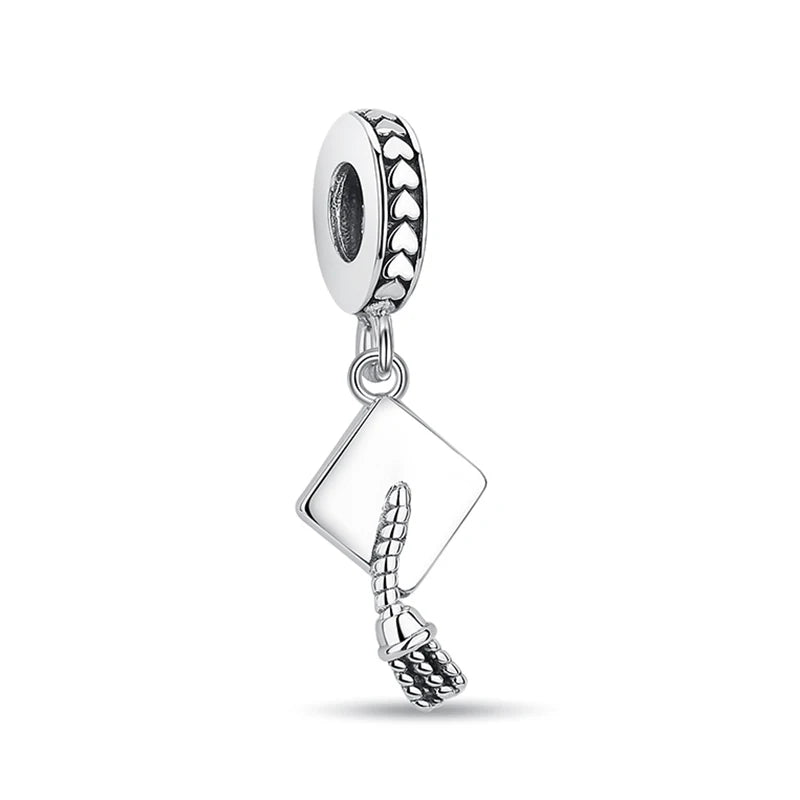 A silver family tree charm necklace featuring a leaf design and a textured pendant.